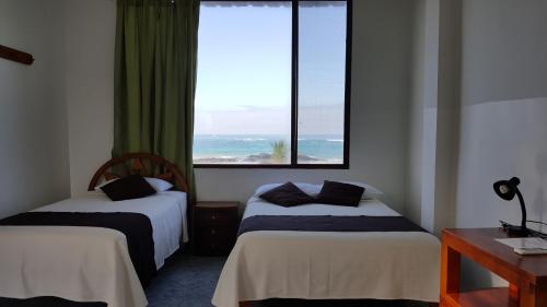 Postel nebo postele na pokoji v ubytování Hotel La Jungla