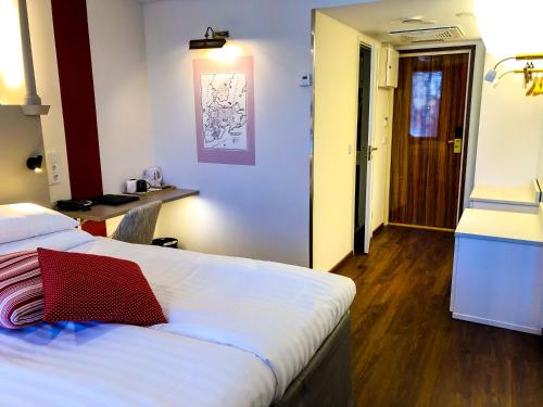 Postel nebo postele na pokoji v ubytování Original Sokos Hotel Seurahuone Kotka