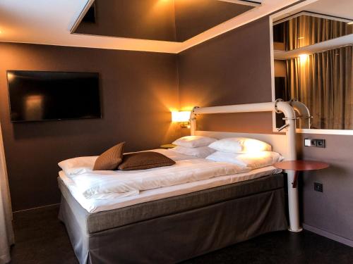Postel nebo postele na pokoji v ubytování Original Sokos Hotel Seurahuone Kotka