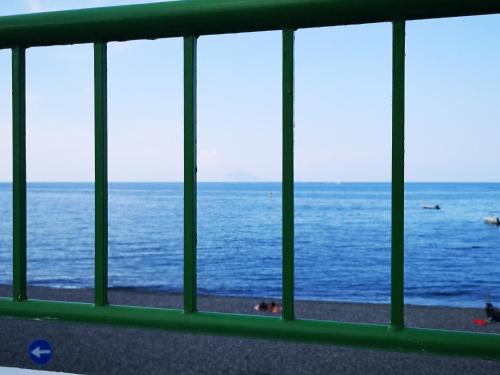 a view of the ocean from a window at CannetoMare in Canneto