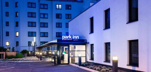 a building with a pay inn sign in front of it at Park Inn by Radisson Luxembourg City in Luxembourg
