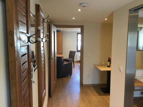 a room with a hallway with a chair and a desk at Gasthof zum Ochsen in Mössingen