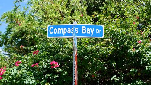 a blue street sign for comparisons bay drive at Beautiful Hollywood style home next to Disney in Kissimmee