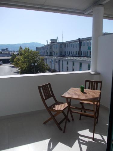 two chairs and a table on a balcony at Rooms Vodisek - Depandansa Hotela Capris Capodistria Boutique in Koper