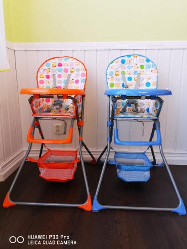 two high chairs sitting next to each other at Liahof in Ullared