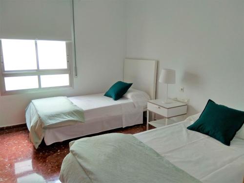 Ein Bett oder Betten in einem Zimmer der Unterkunft Disfruta - Enjoy Valencia Ayuntamiento