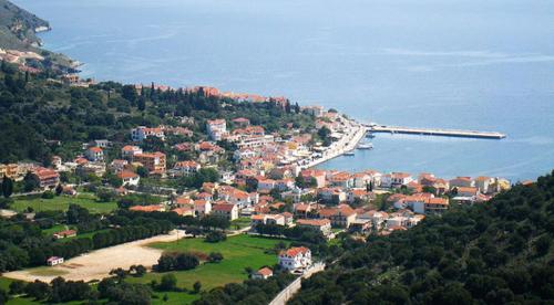 an aerial view of a town on a hill near the water at Evangelia in Ayia Evfimia