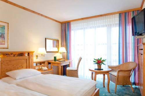 En eller flere senger på et rom på Hotel Amberger Hof