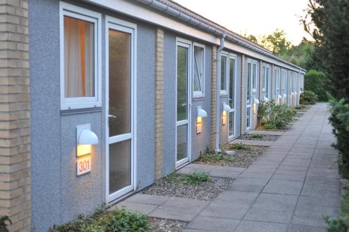 a row of windows on the side of a building at Hotel Balka Strand in Neksø
