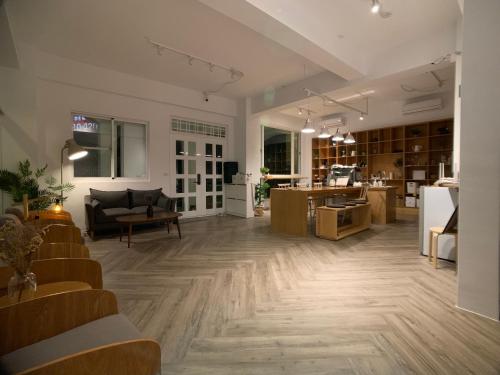 a living room with a couch and a table at Lof/it in Taitung City
