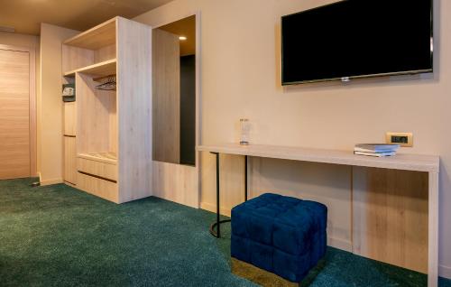 a room with a flat screen tv on a wall at Priska Med Luxury Rooms in Split
