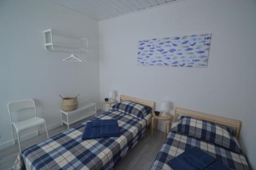 A bed or beds in a room at Case degli Avi, camere nel Borgo marinaro