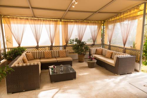 a large living room with couches and a table at La Résidence in Dakar