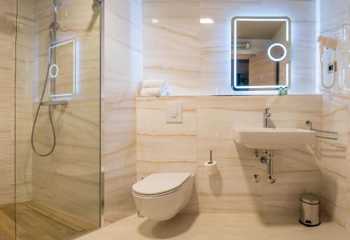 a bathroom with a toilet and a sink and a shower at Priska Med Luxury Rooms in Split
