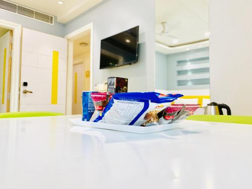 a plate of food sitting on a kitchen counter at City Empire New Delhi Train Station in New Delhi