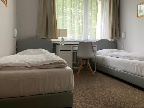 Un ou plusieurs lits dans un hébergement de l'établissement Hotel Berg