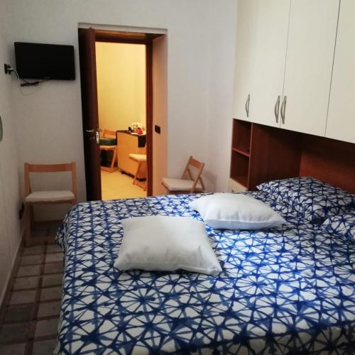 a bedroom with two beds with pillows on it at Stanzetta del Cavaliere in Atrani