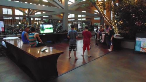 a group of people standing around in a mall at The Academy Hotel Colorado Springs in Colorado Springs