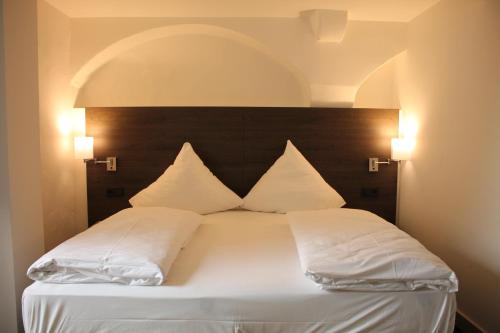 Ένα ή περισσότερα κρεβάτια σε δωμάτιο στο MO Hotel by WMM Hotels