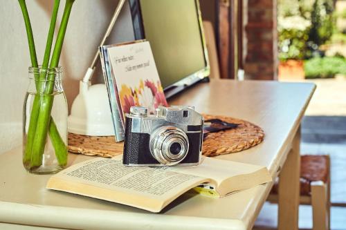 a camera sitting on top of a book on a table at B&B Daria - Deb'S Monticchiello in Monticchiello