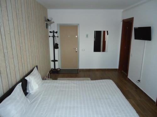 Ένα ή περισσότερα κρεβάτια σε δωμάτιο στο Hotel Nova Residence