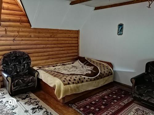 מיטה או מיטות בחדר ב-U Odesyta