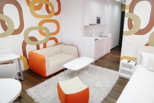 Et opholdsområde på STATUS Superior Apartments