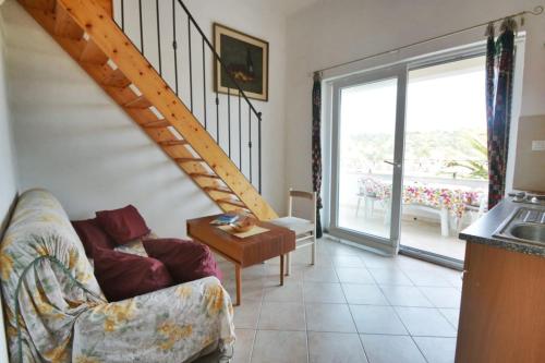 a living room with a staircase and a couch at Villa Carmen in Sali