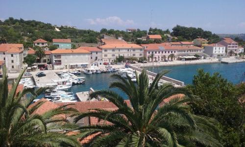 a marina with boats in the water and buildings at Villa Carmen in Sali