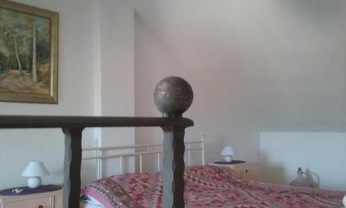 a bedroom with a bed and two tables with lamps at Villa Carmen in Sali
