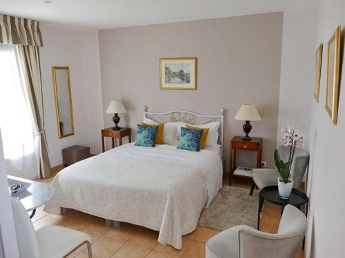 Ένα ή περισσότερα κρεβάτια σε δωμάτιο στο Chambres d'Hôtes Les Vieilles Digues
