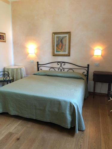 Ein Bett oder Betten in einem Zimmer der Unterkunft Country Villas Fattoria Le Guardiole