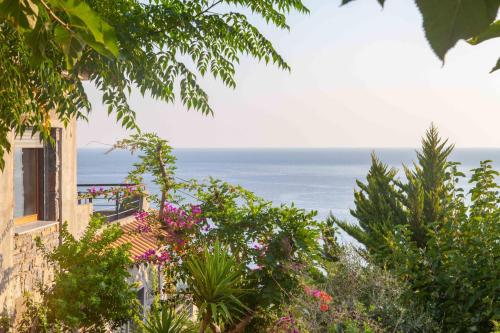 a view of the ocean from a house at Frictories station of residency in Limniónas