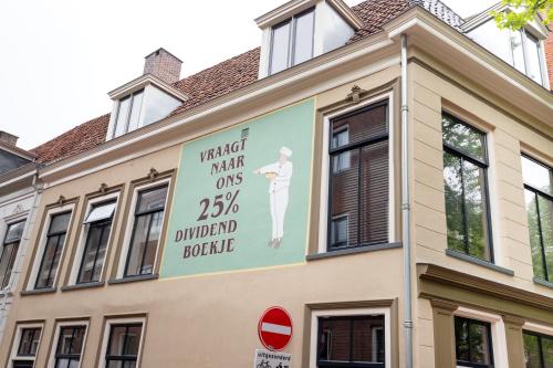 a sign on the side of a building at Boutique hotel WKNDS in Leeuwarden