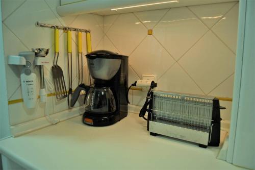 a blender sitting on a counter in a kitchen at Casa Plaza Sierra Grazalema in Grazalema
