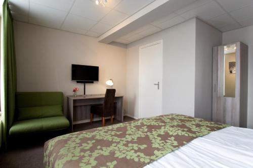 Ένα ή περισσότερα κρεβάτια σε δωμάτιο στο Hotel Old Dutch Bergen op Zoom