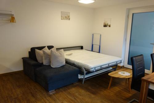 a small room with a bed and a couch at Haus Helvetia in Ladis