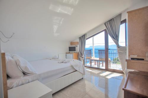 Ένα ή περισσότερα κρεβάτια σε δωμάτιο στο Hotel Ferah