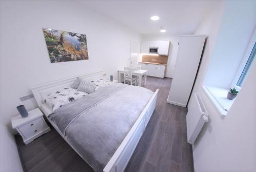 Postel nebo postele na pokoji v ubytování JM Apartments