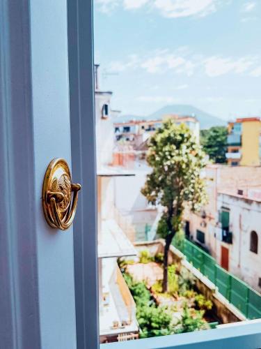 a door with a view of a city at Villa Cua in Ercolano