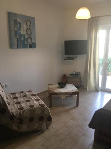 a living room with a couch and a coffee table at Regina Apartments in Lassi