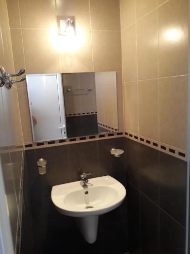 a bathroom with a sink and a mirror at Studio-Pomorie in Pomorie