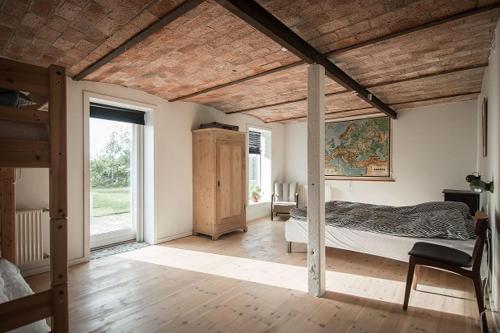 Postel nebo postele na pokoji v ubytování Sdr Grønkær Feriehus - holiday house