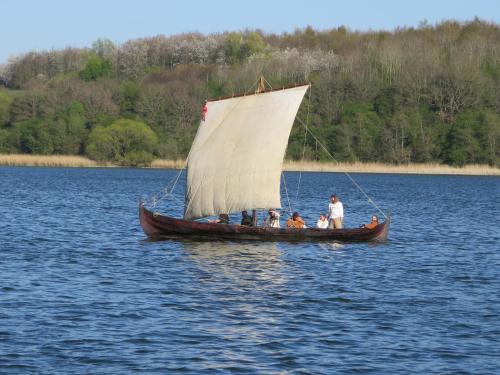 a group of people on a small boat on the water at Ferienwohnungen am Danewerk in Dannewerk