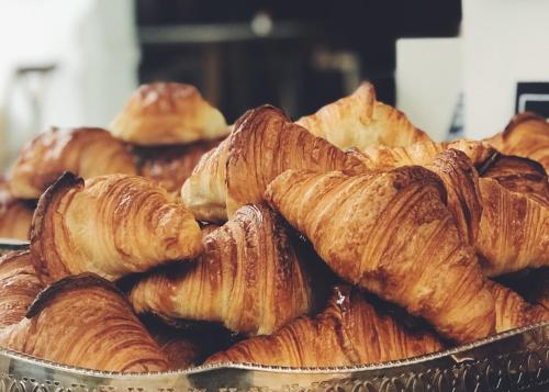 a pile of croissants and other pastries on a table at Balmoral House Bed & Breakfast in St. John's