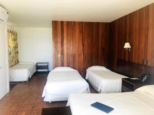 Кровать или кровати в номере Panamericana Hotel Arica
