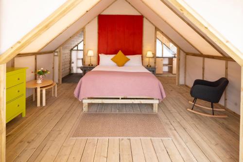 a bedroom with a large bed in a room at Killarney Glamping at the Grove, Suites and Lodges in Killarney