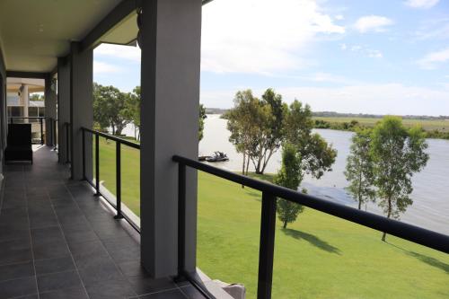 a balcony with a view of a river at River Devine in White Sands