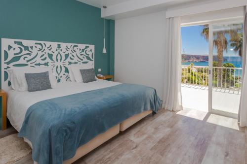 Ένα ή περισσότερα κρεβάτια σε δωμάτιο στο Mareta View - Boutique Bed & Breakfast
