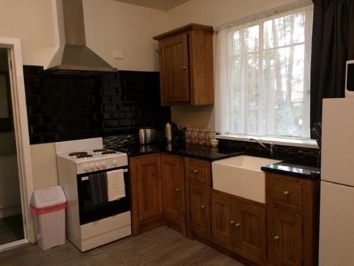 A kitchen or kitchenette at Fell Estate Cottages